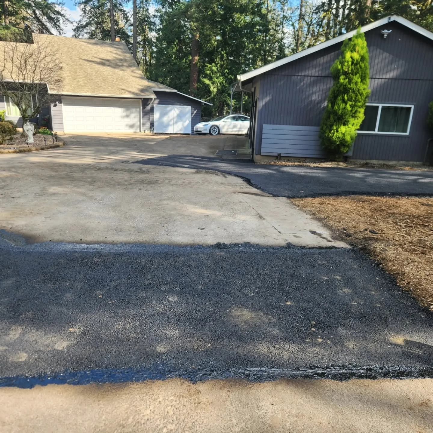 Asphalt patch on a residential driveway