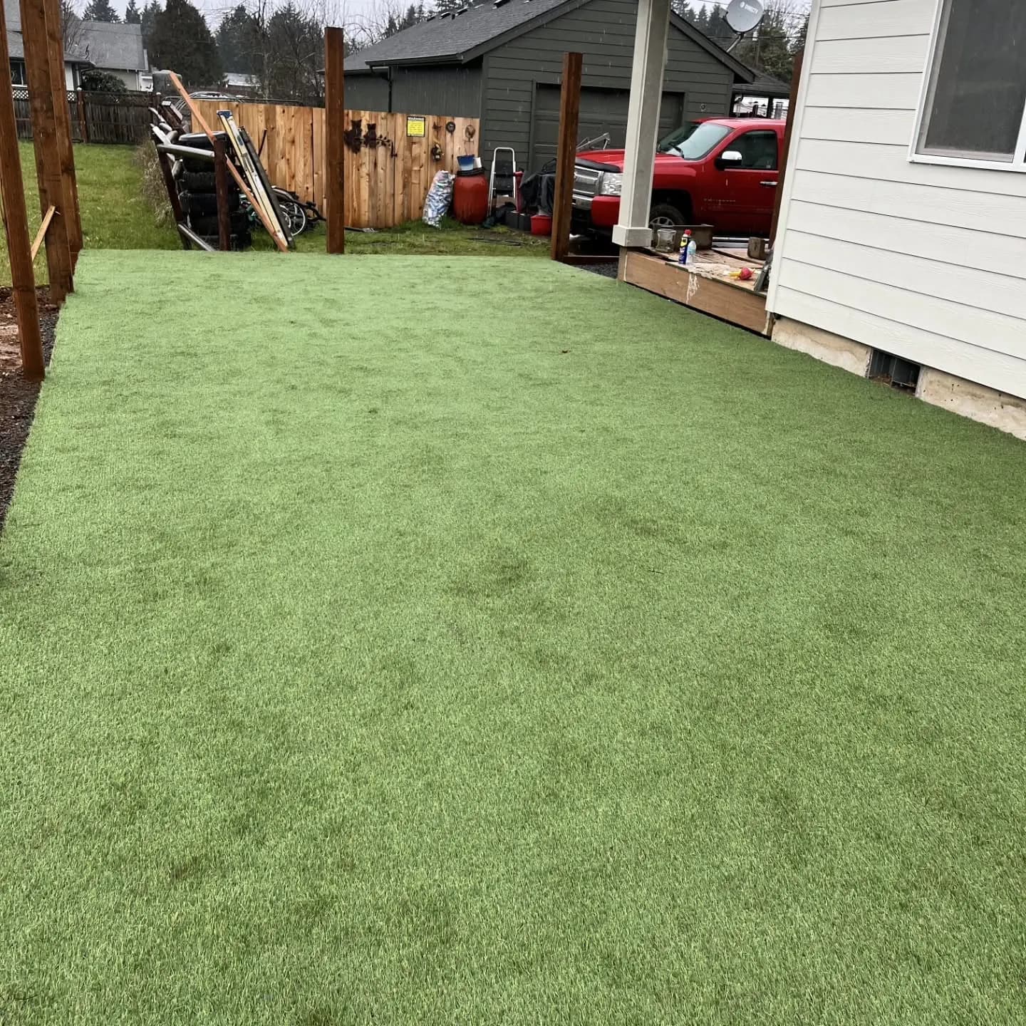 Turf yard and new fence posts at the duplex